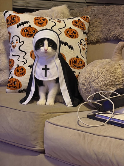 Cat wearing the nun costume on a Halloween couch