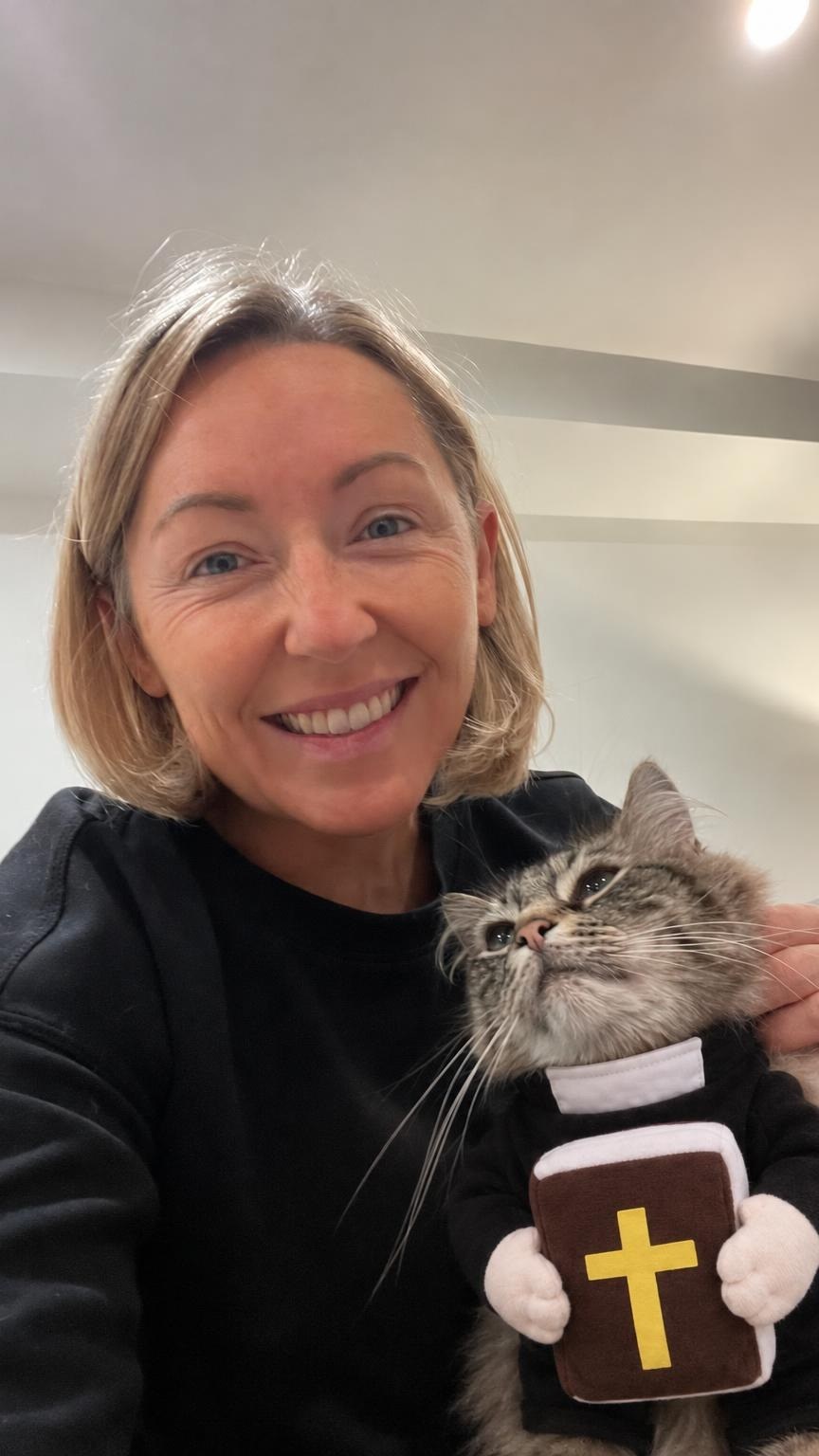 Owner selfie with her cat in the Holy Priest costume